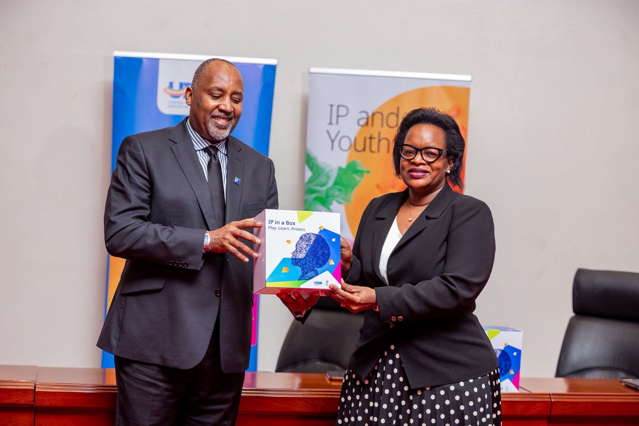 Uganda Registration Services Bureau leadership receiving IP in a Box, the IP training game designed and delivered by Akatuuti, from WIPO Africa